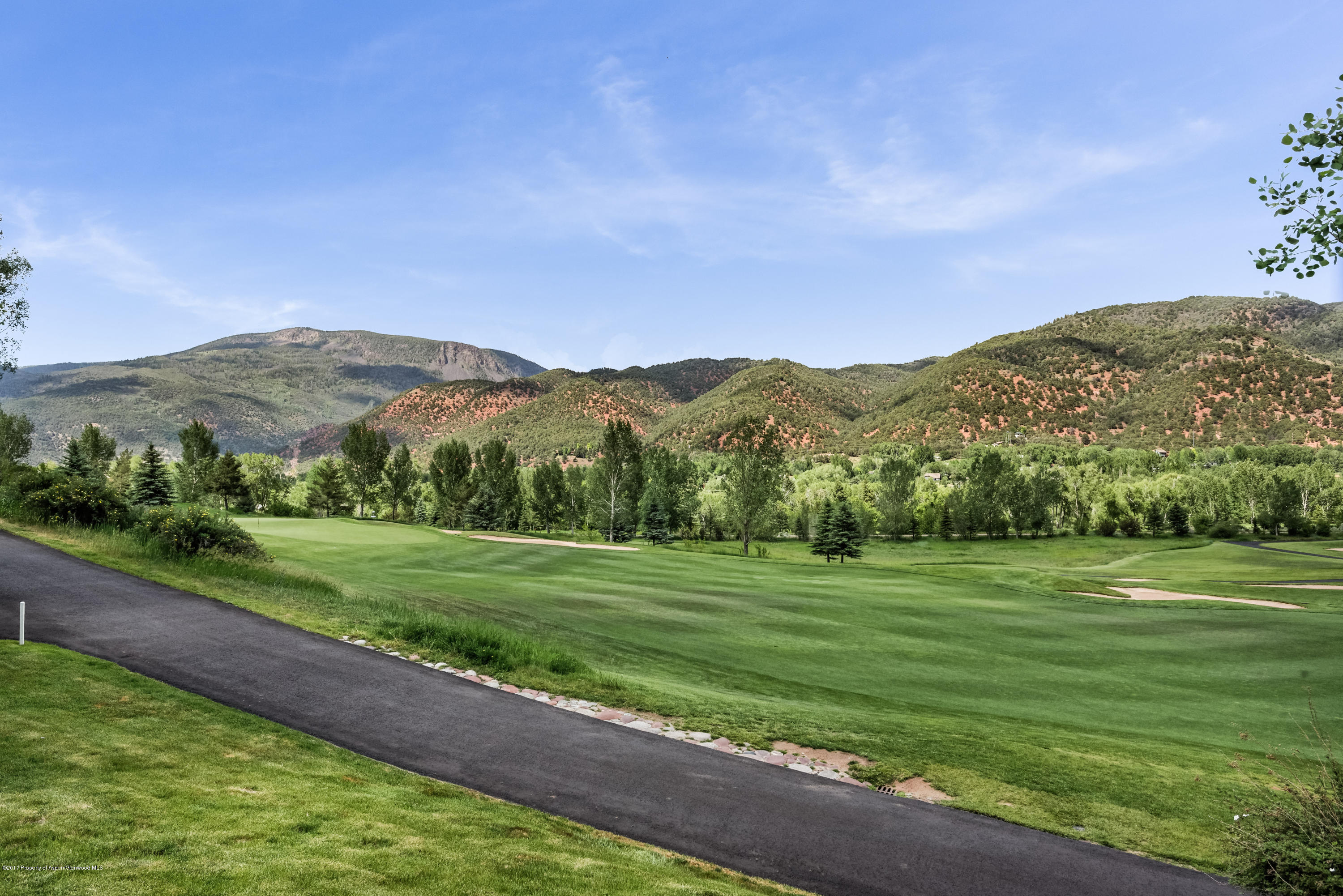 39 Altamira Ranch Road, Unit CABIN 39 Basalt, CO 81621 - Photo 23 of 23 a view of a grassy field with mountains in the background