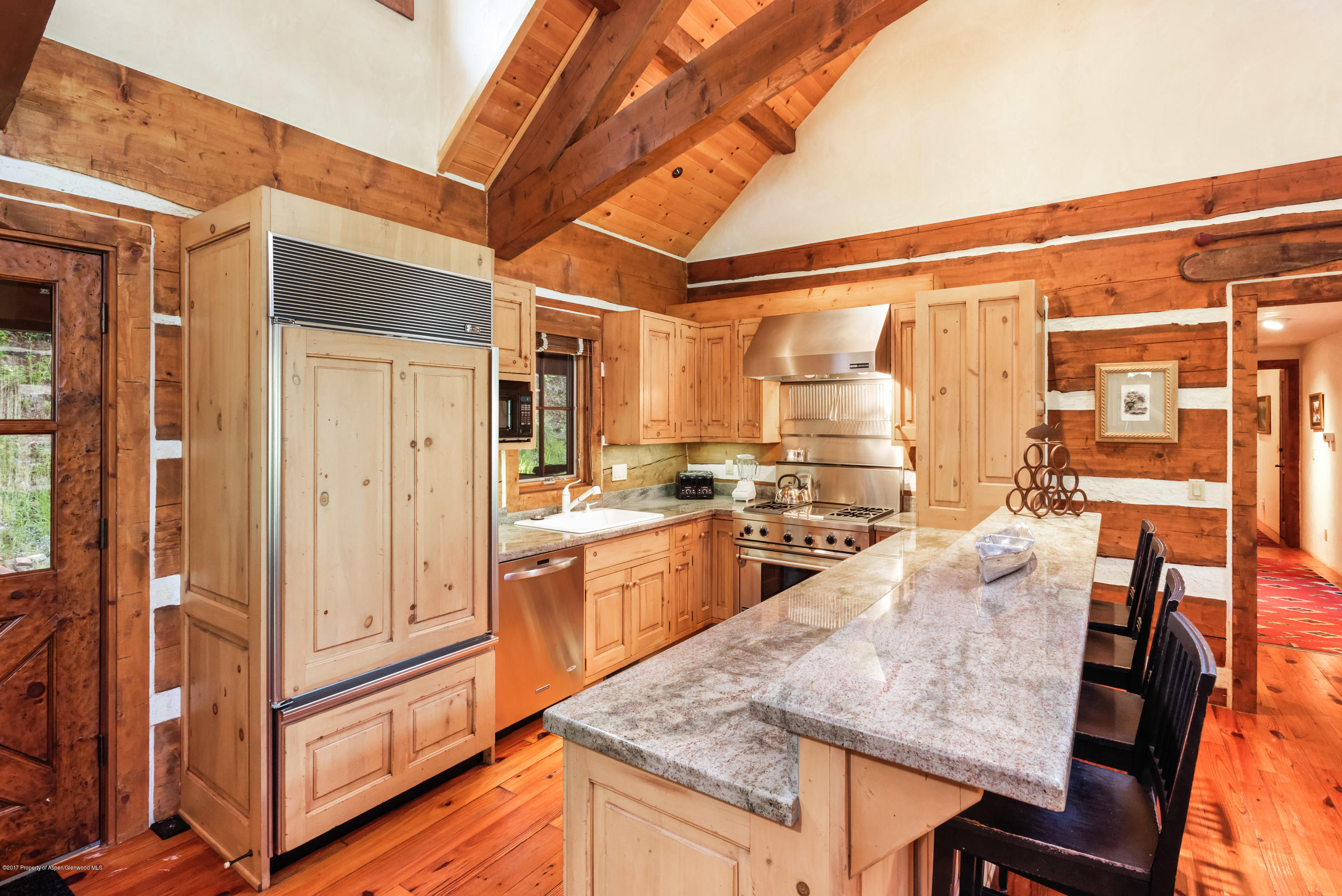 39 Altamira Ranch Road, Unit CABIN 39 Basalt, CO 81621 - Photo 6 of 23 a kitchen with cabinets and wooden floor