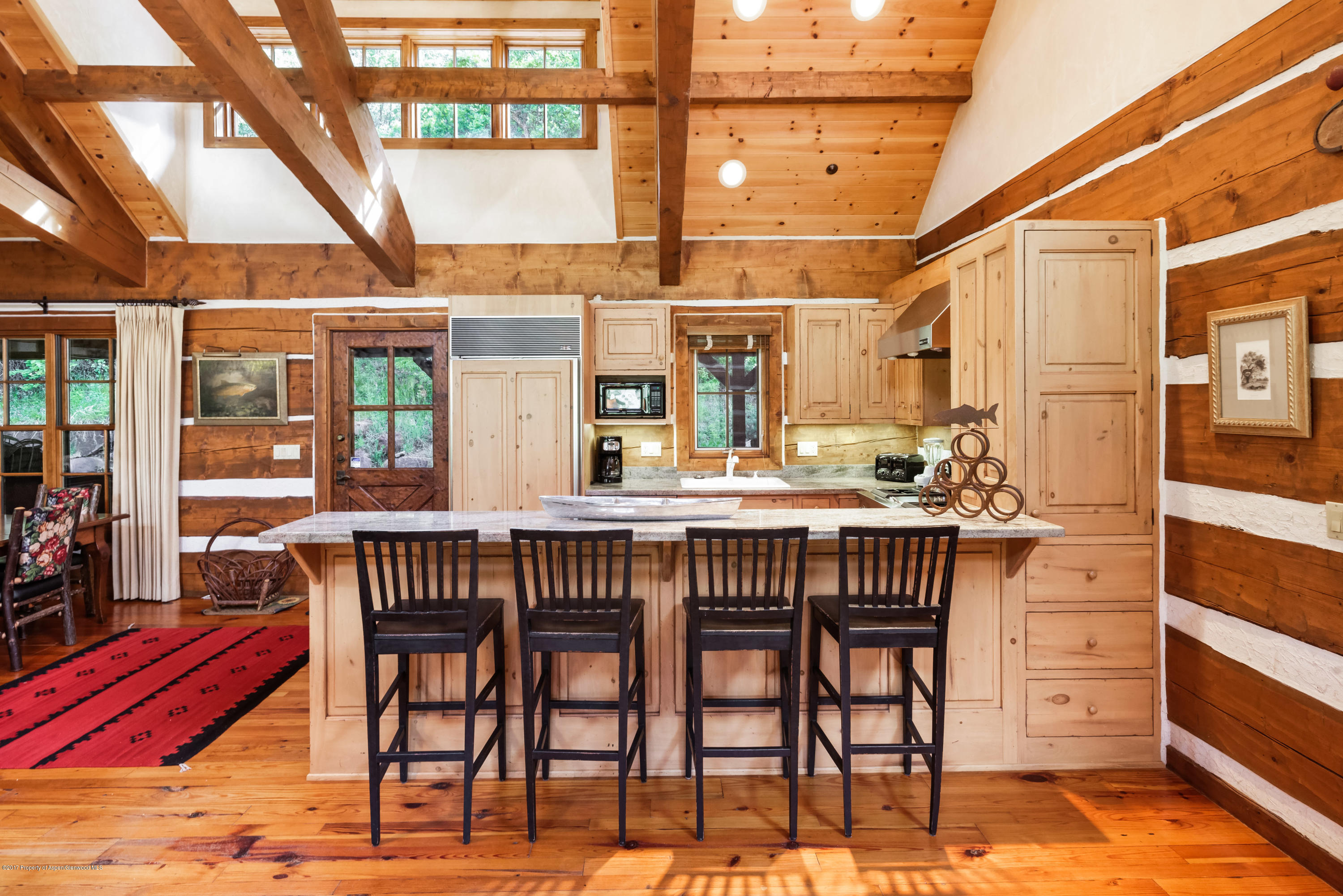 39 Altamira Ranch Road, Unit CABIN 39 Basalt, CO 81621 - Photo 7 of 23 a view of an outdoor space with a table and chairs
