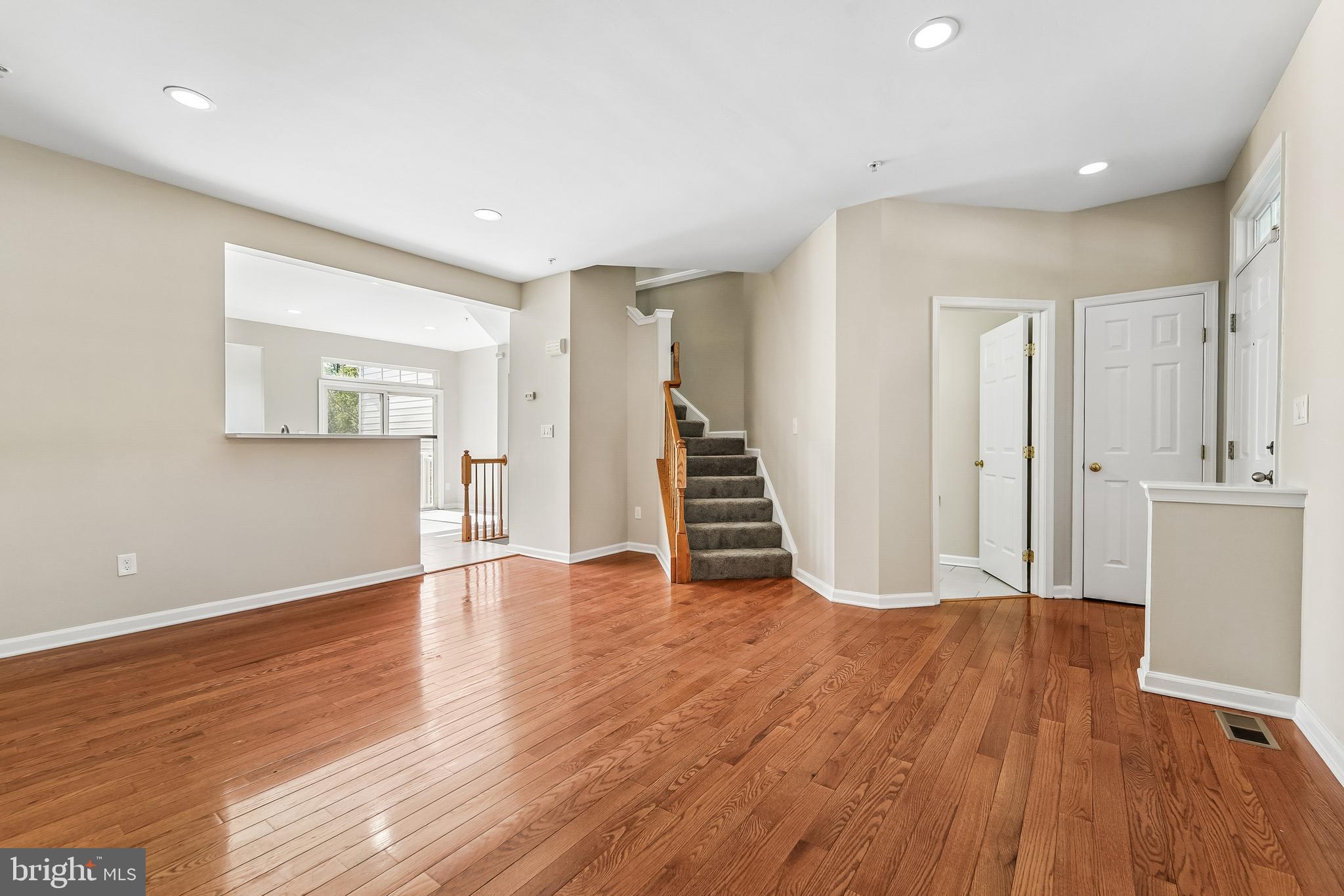 1461 Pangbourne Way Hanover, MD 21076 - Photo 9 of 51 a view of a livingroom with wooden floor and staircase