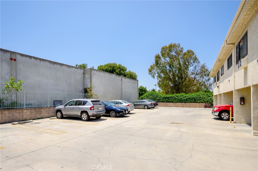 16226 Vanowen Street, Unit 207 Van Nuys, CA 91406 - Photo 17 of 17 a car parked on the side of a street