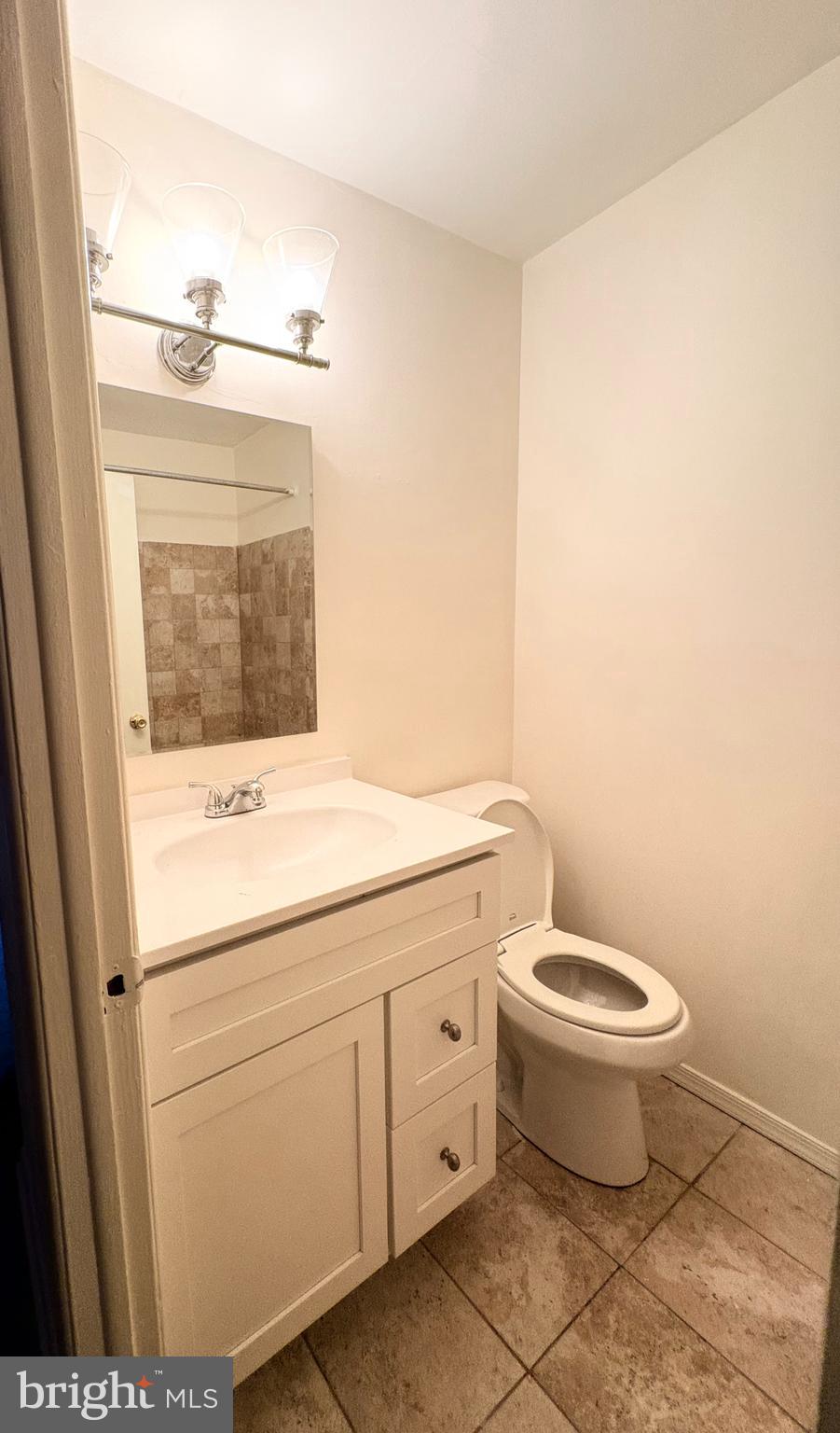 261 Ridgeway Terrace Philadelphia, PA 19116 - Photo 12 of 14 a bathroom with a toilet sink and mirror