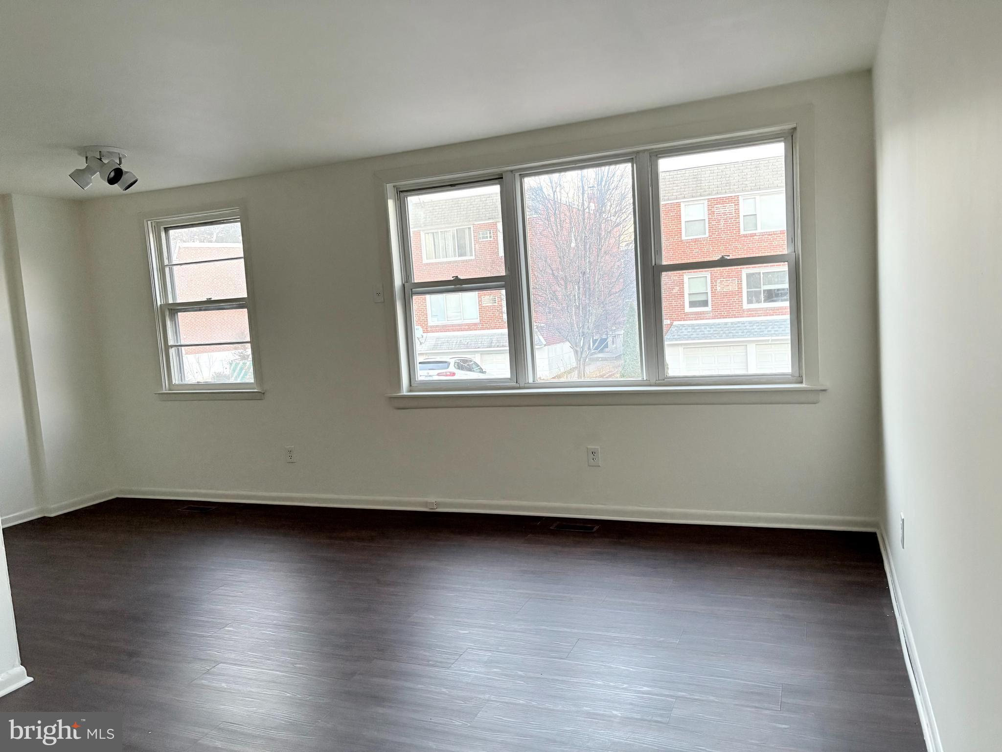 261 Ridgeway Terrace Philadelphia, PA 19116 - Photo 4 of 14 an empty room with wooden floor and windows
