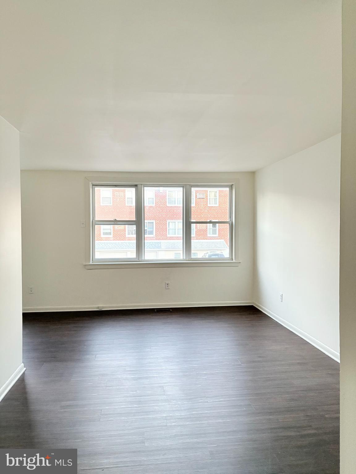 261 Ridgeway Terrace Philadelphia, PA 19116 - Photo 6 of 14 a view of an empty room with wooden floor and a window