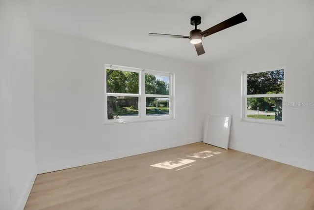 an empty room with windows