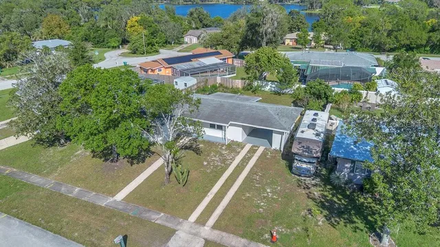 an aerial view of house with a yard