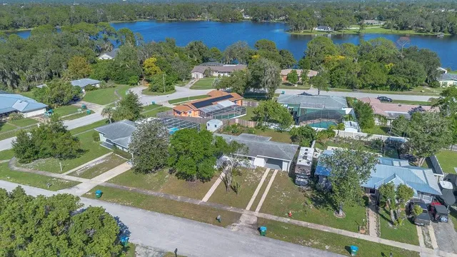 an aerial view of residential house with outdoor space and river view