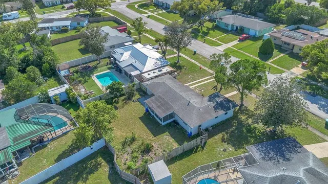 an aerial view of a house with a garden