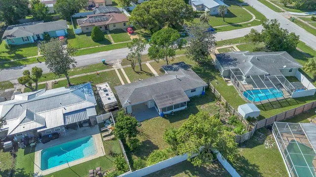 an aerial view of a house with outdoor space