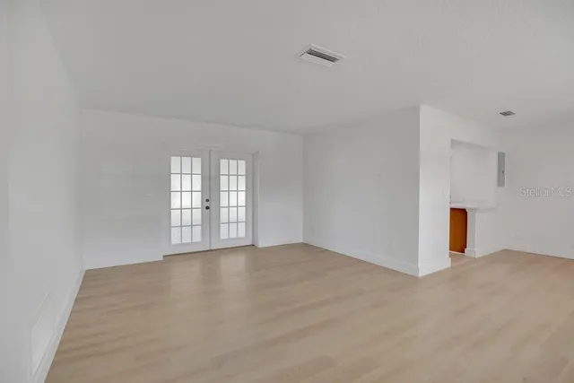 a view of an empty room with a window