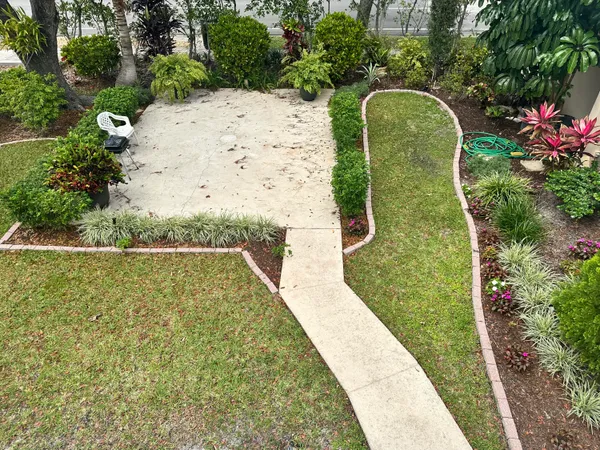 a view of a swimming pool with a yard