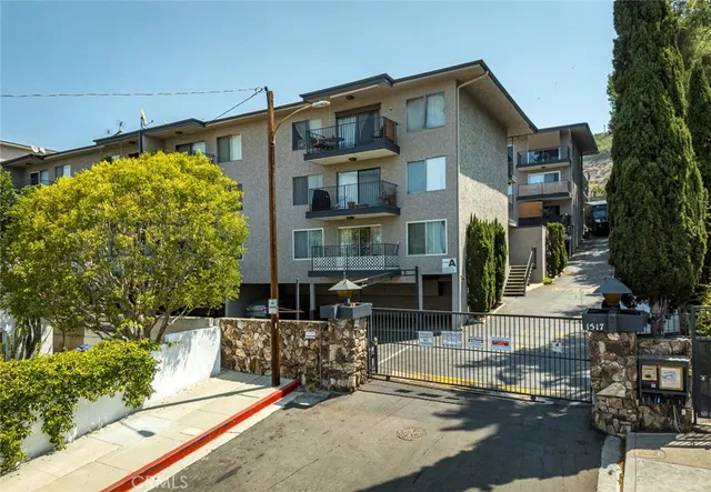a front view of a building with garden