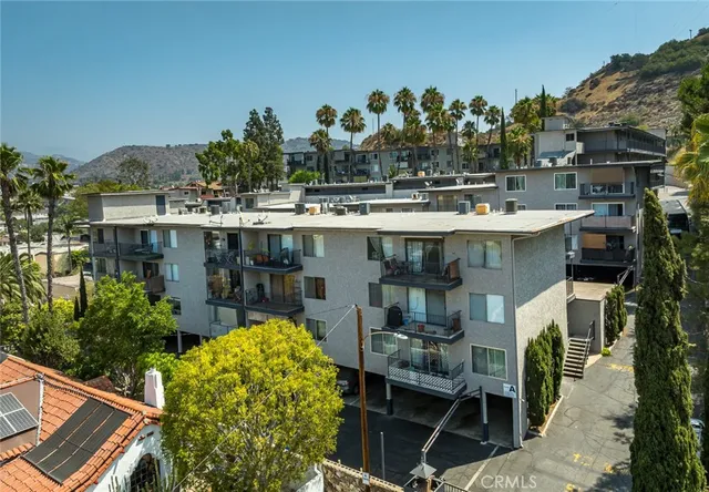 a view of a chairs and table in the patio