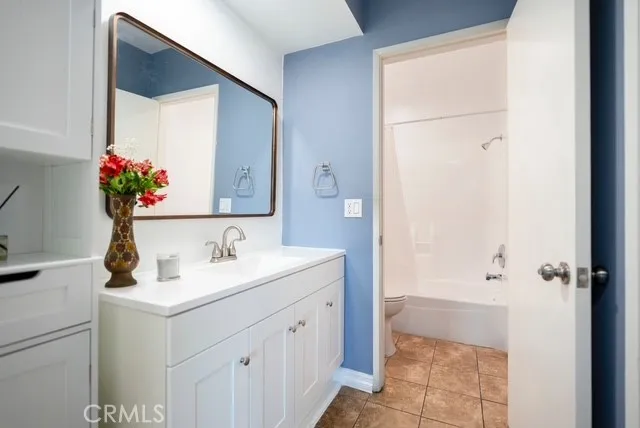 a bathroom with a toilet and a bathtub