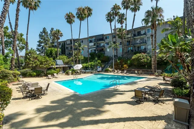 a view of a swimming pool with a patio