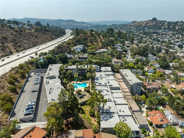 an aerial view of residential houses with outdoor space