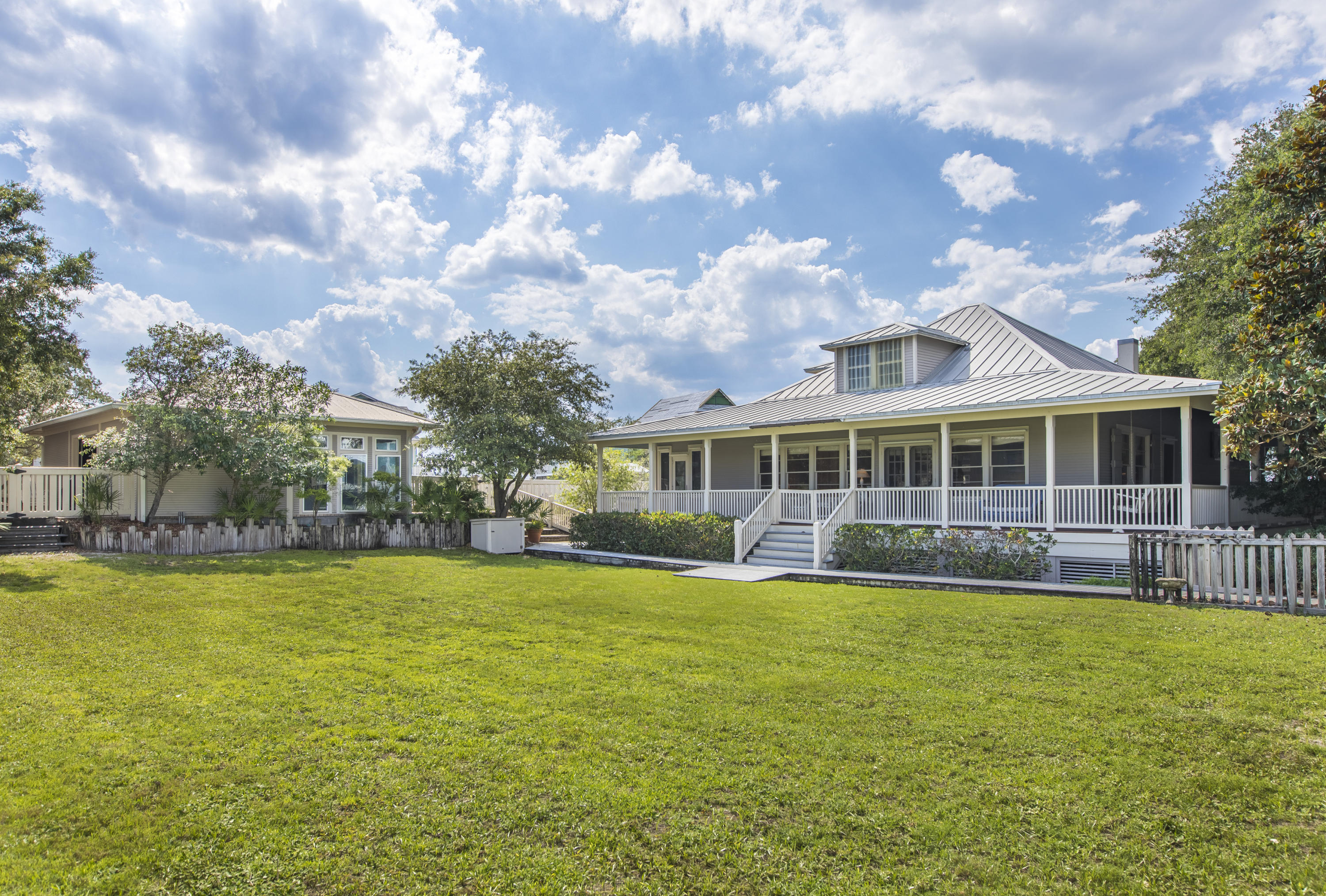 490 Defuniak Street Santa Rosa Beach, FL 32459 - Photo 11 of 46 a view of a house with a big yard and potted plants