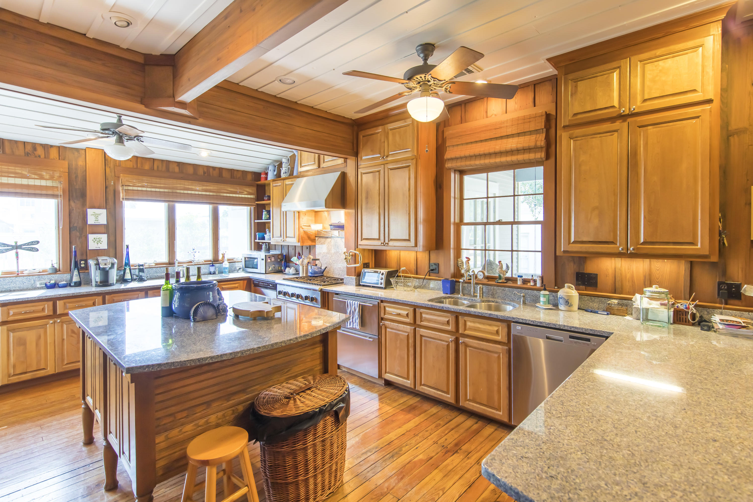 490 Defuniak Street Santa Rosa Beach, FL 32459 - Photo 12 of 46 a kitchen with a stove a sink and a refrigerator