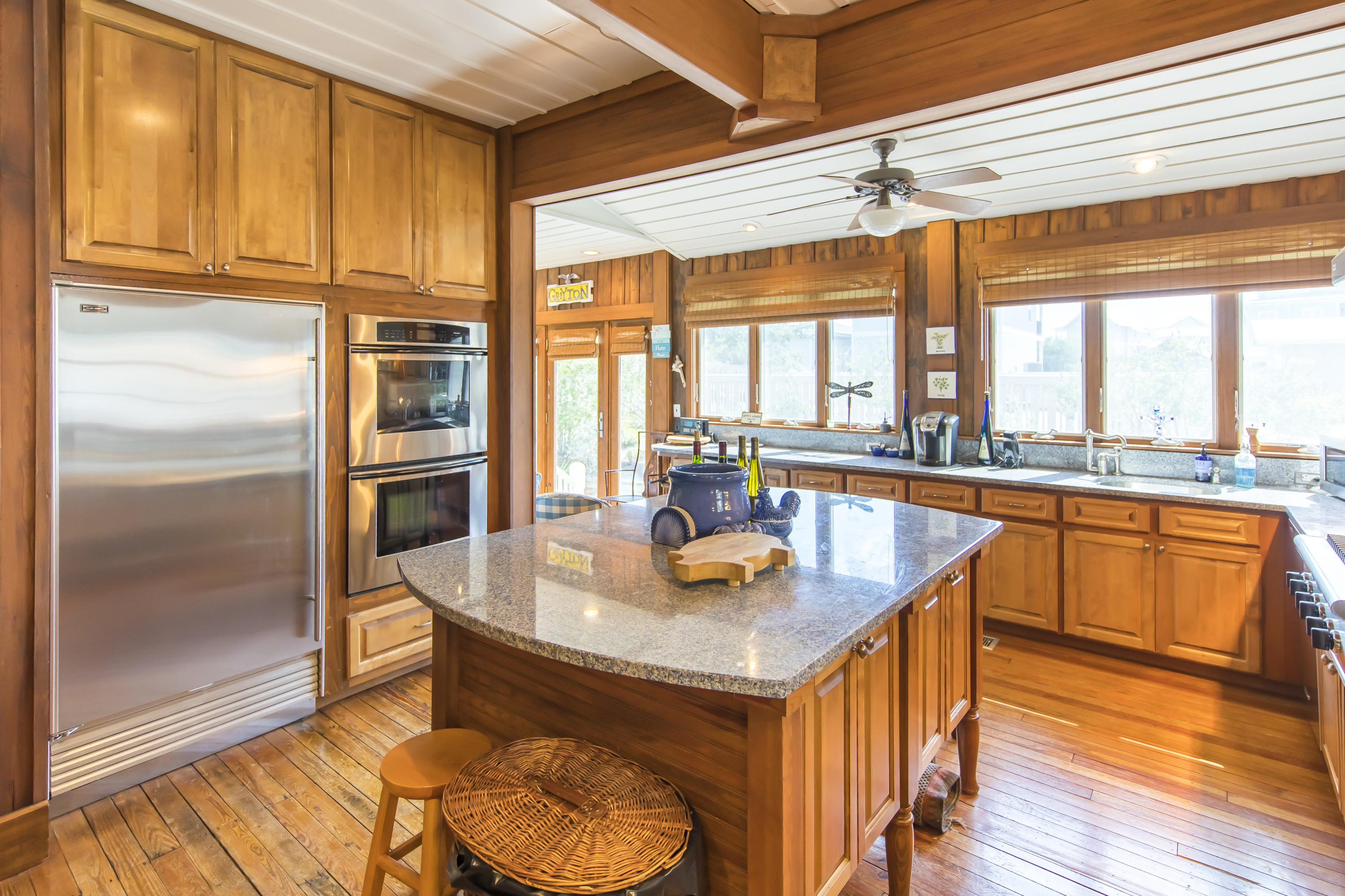 490 Defuniak Street Santa Rosa Beach, FL 32459 - Photo 13 of 46 a kitchen with stainless steel appliances granite countertop a sink and a refrigerator