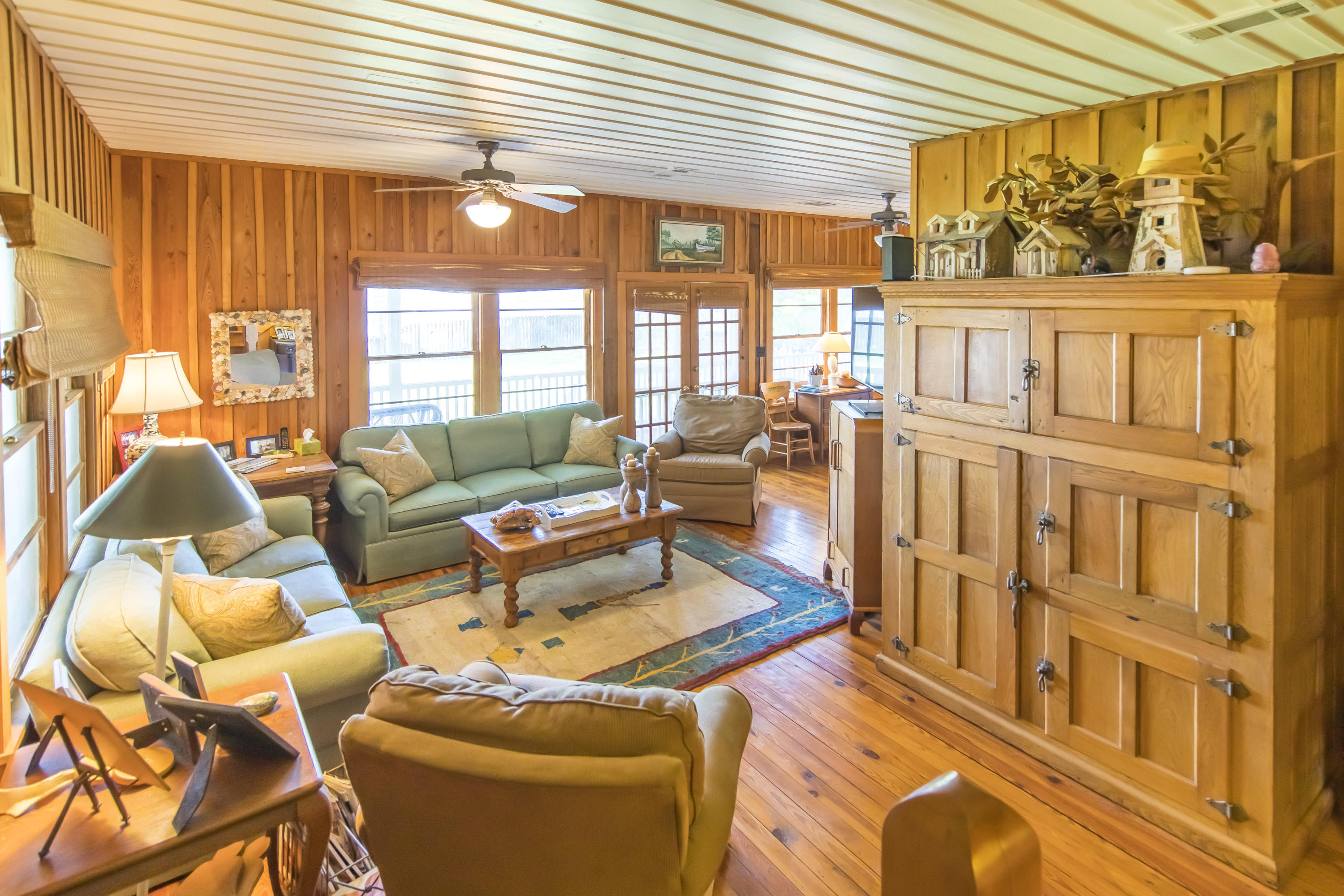 490 Defuniak Street Santa Rosa Beach, FL 32459 - Photo 17 of 46 a living room with furniture and a large window