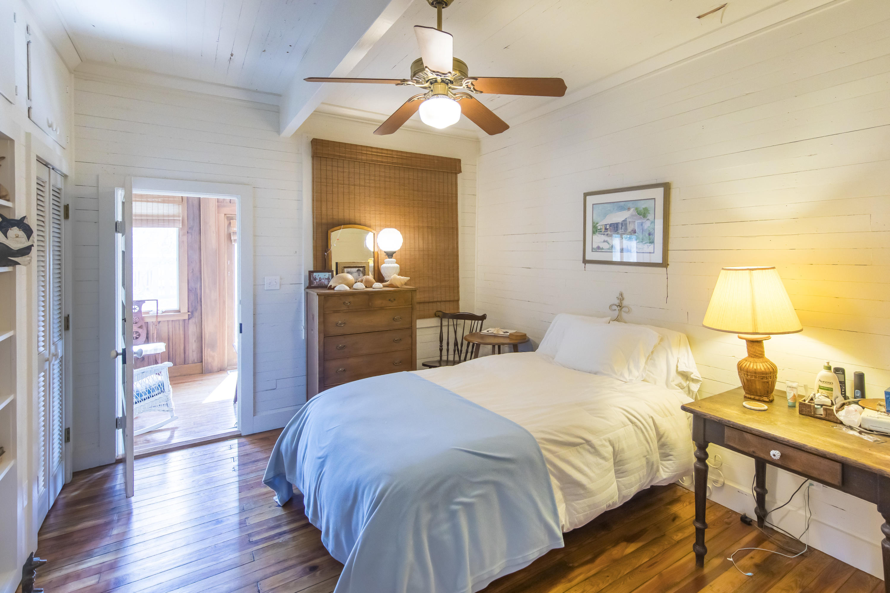 490 Defuniak Street Santa Rosa Beach, FL 32459 - Photo 20 of 46 a spacious bedroom with a bed and a chandelier