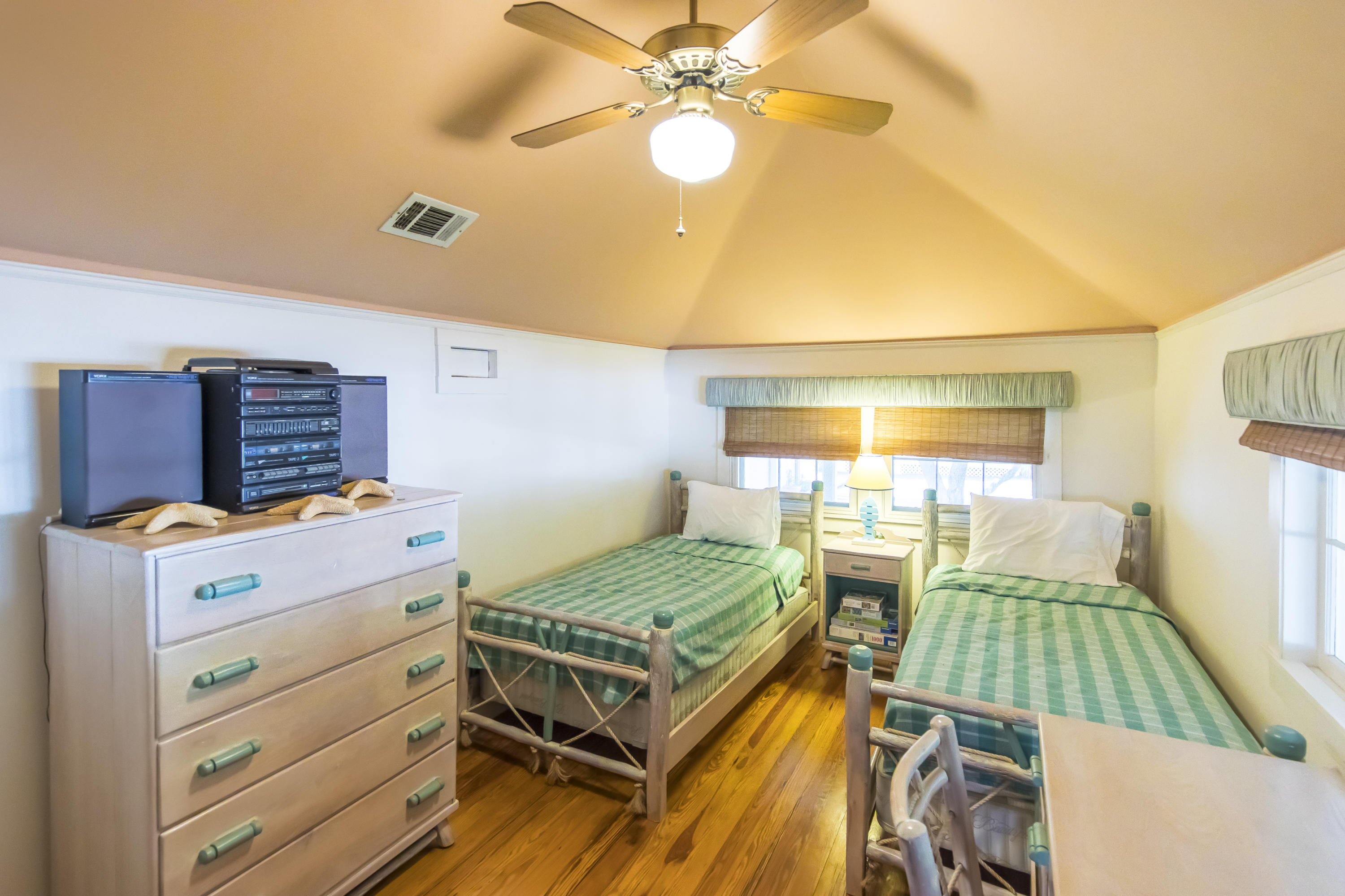 490 Defuniak Street Santa Rosa Beach, FL 32459 - Photo 29 of 46 a bedroom with a bed and a window