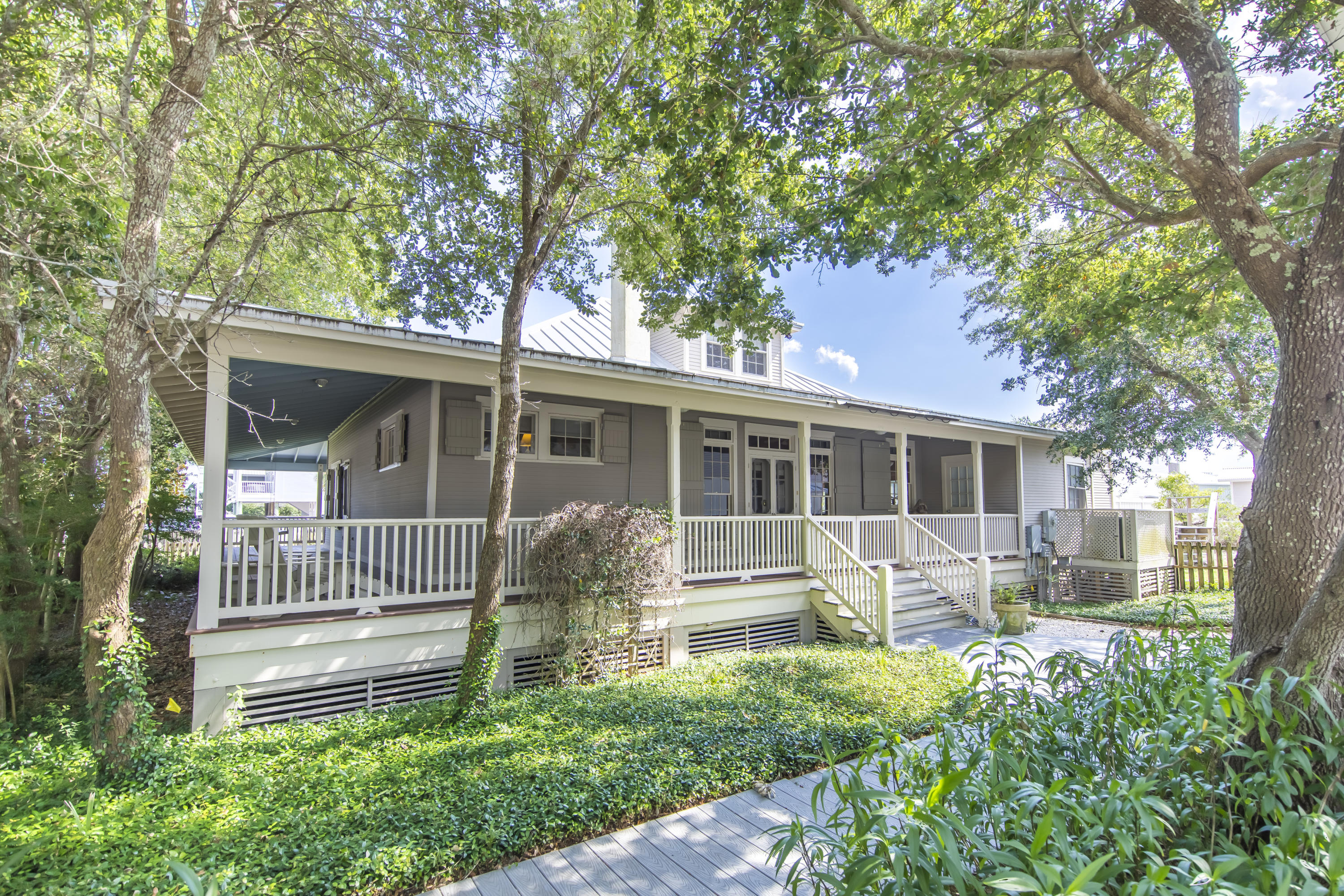 490 Defuniak Street Santa Rosa Beach, FL 32459 - Photo 4 of 46 a front view of a house with garden