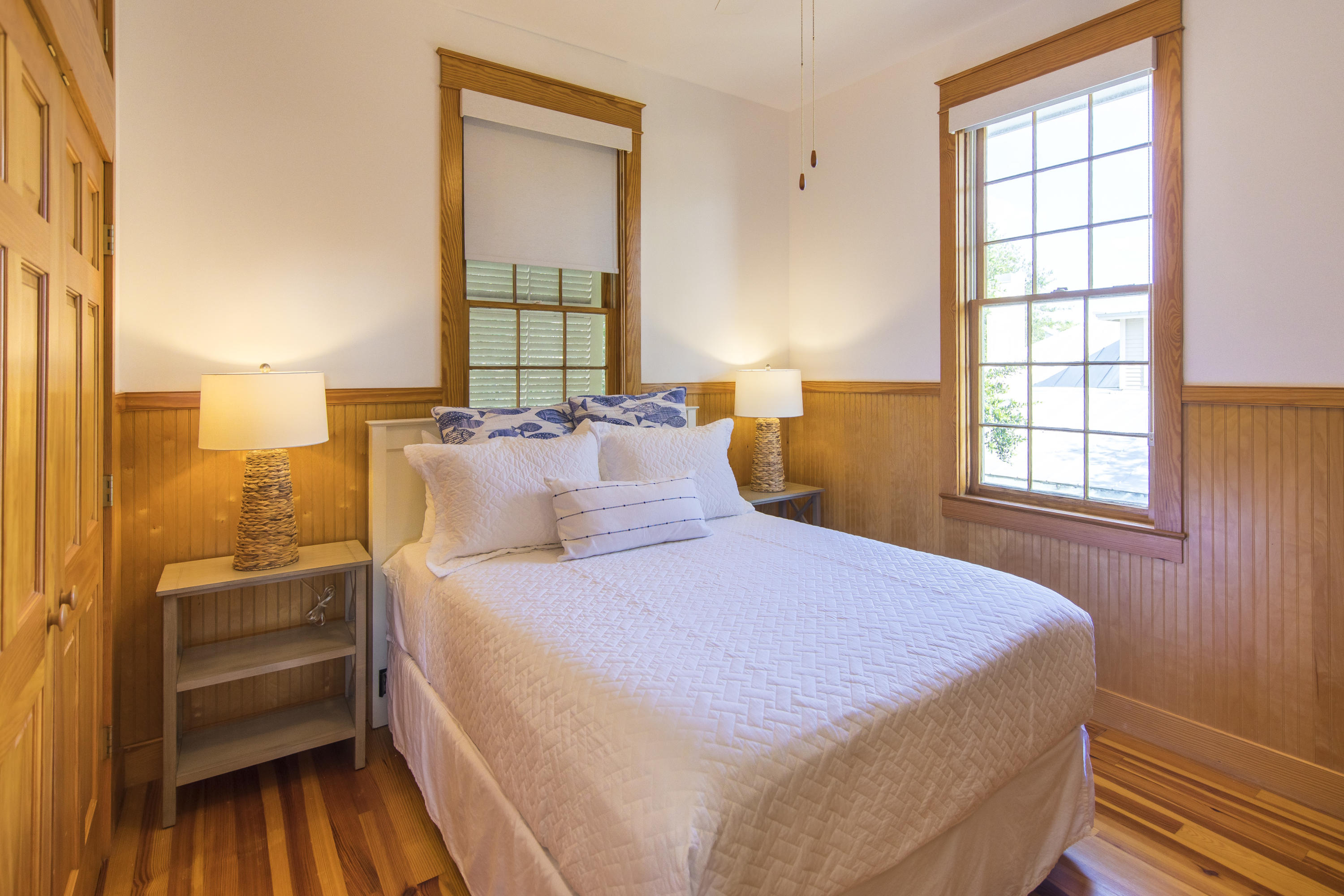 490 Defuniak Street Santa Rosa Beach, FL 32459 - Photo 33 of 46 a bedroom with a bed and a window