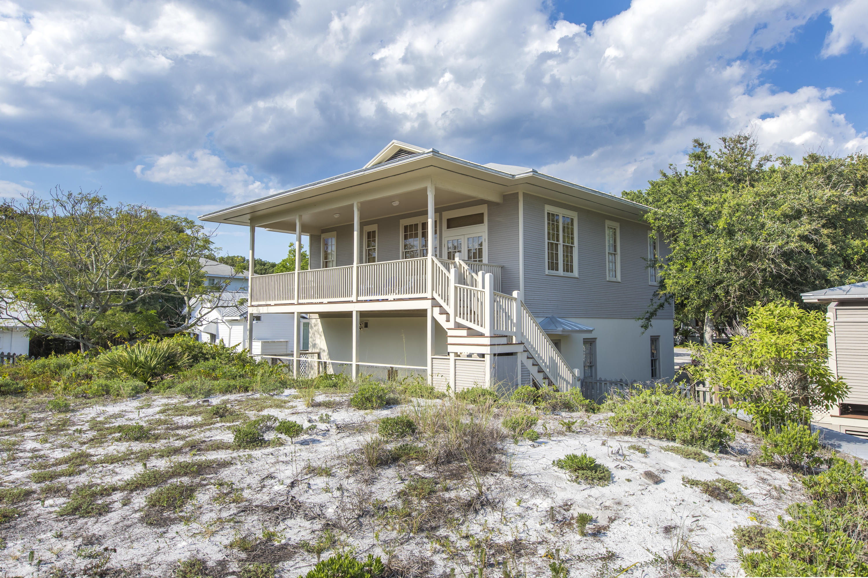 490 Defuniak Street Santa Rosa Beach, FL 32459 - Photo 39 of 46 a front view of a house with a garden