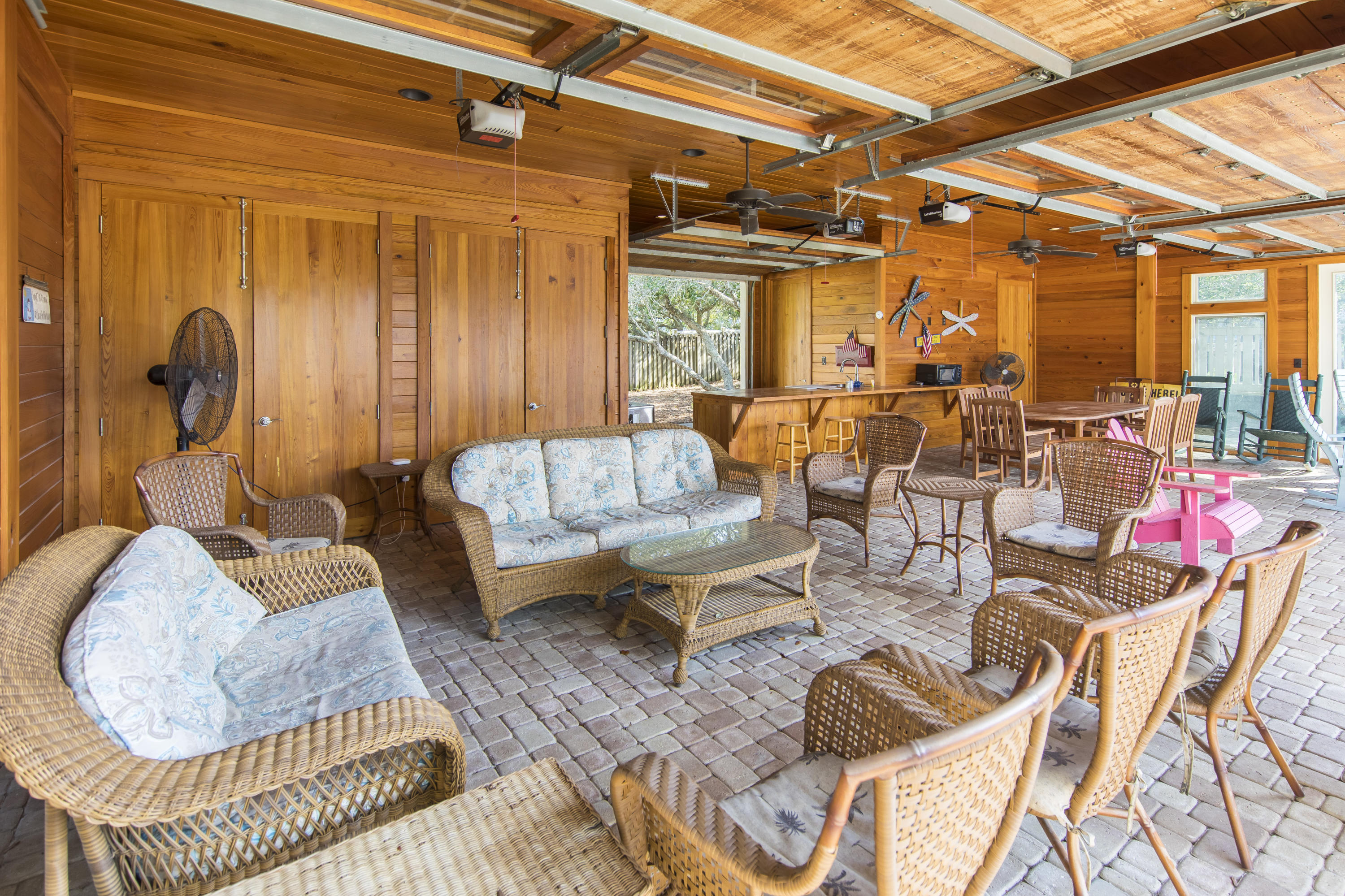 490 Defuniak Street Santa Rosa Beach, FL 32459 - Photo 42 of 46 a outdoor living space with furniture and a black umbrella