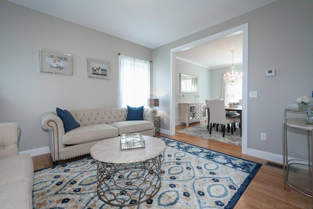 252 West Berlin Road Bolton, MA 01740 - Photo 8 of 34 a living room with furniture and a rug