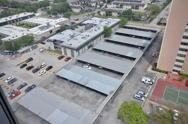 a aerial view of a residential apartment building with a yard