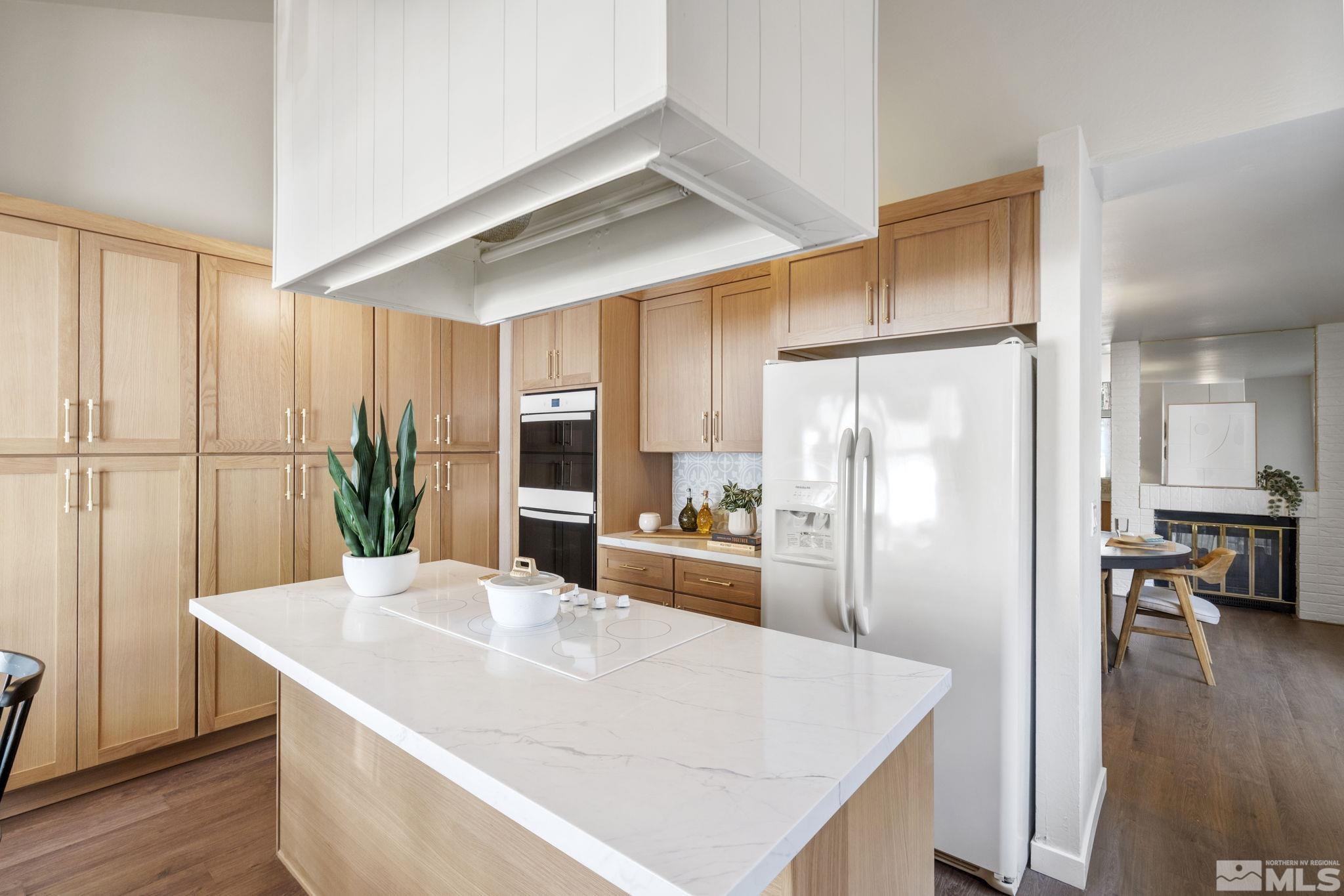 328 Lorraine Court Reno, NV 89509 - Photo 11 of 38 a kitchen with stainless steel appliances a refrigerator and wooden floor