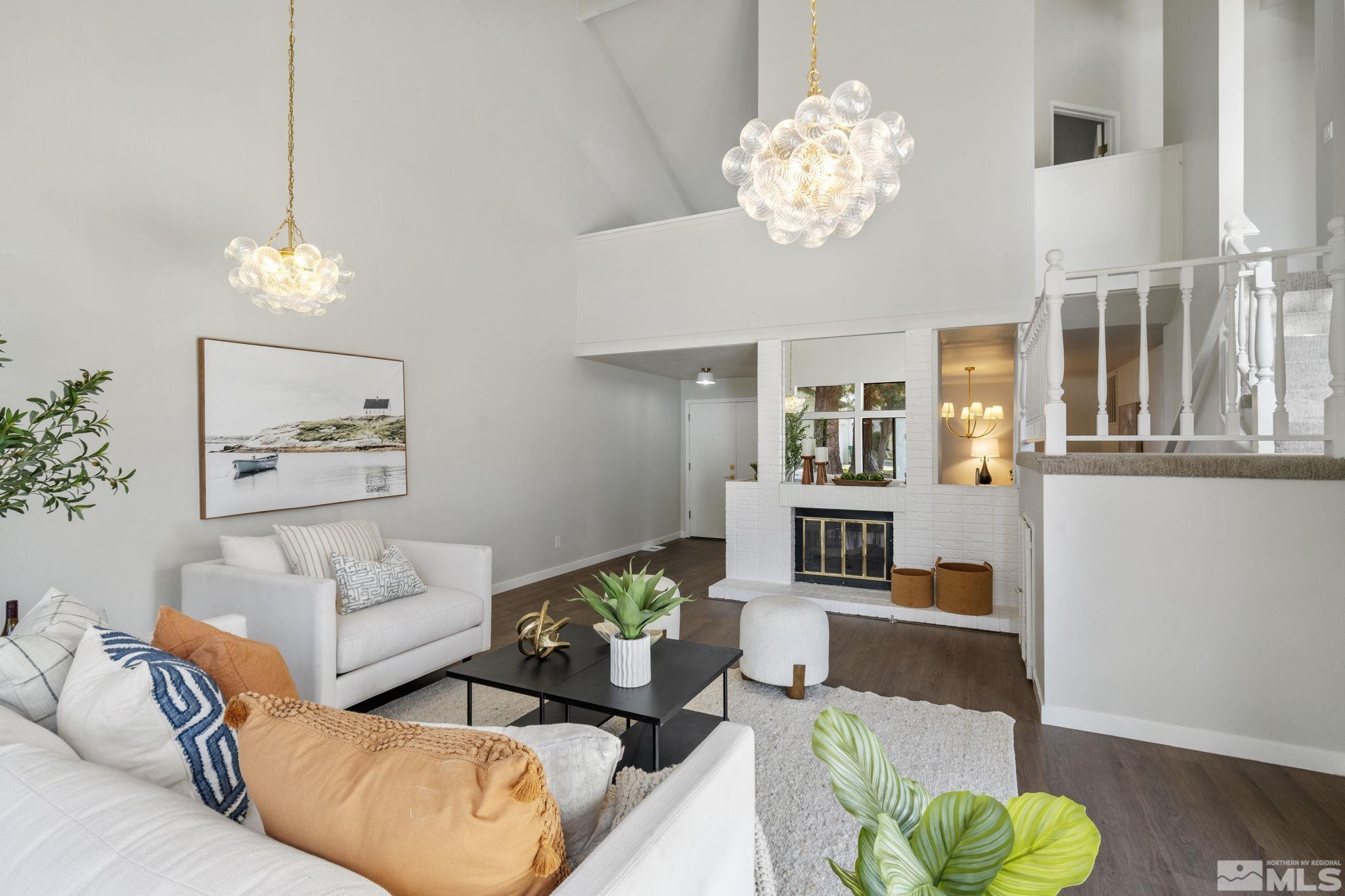 328 Lorraine Court Reno, NV 89509 - Photo 2 of 38 a living room with furniture a chandelier and a table
