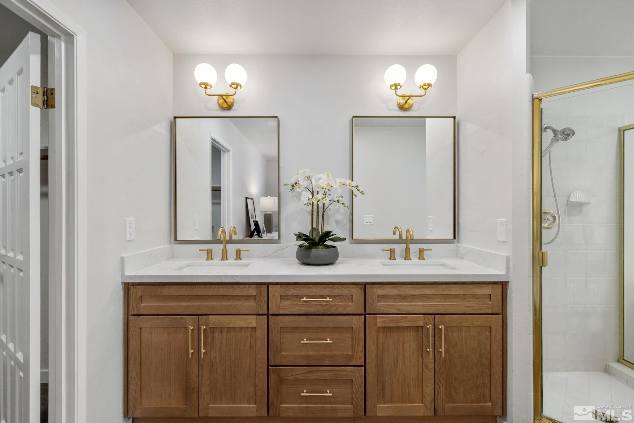 328 Lorraine Court Reno, NV 89509 - Photo 21 of 38 a bathroom with a sink and a mirror
