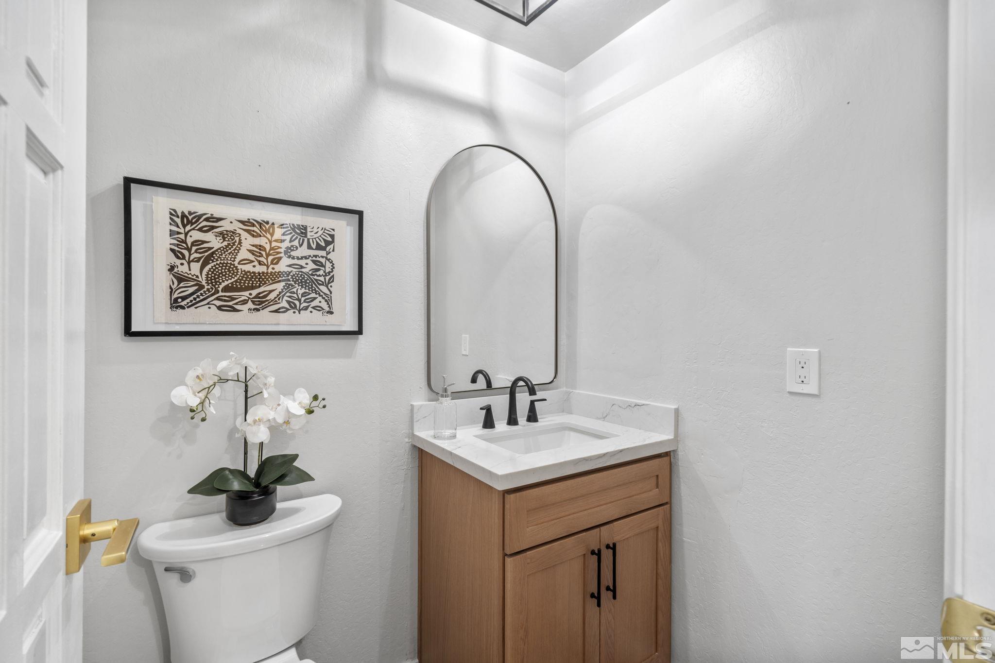 328 Lorraine Court Reno, NV 89509 - Photo 22 of 38 a bathroom with a toilet sink and mirror