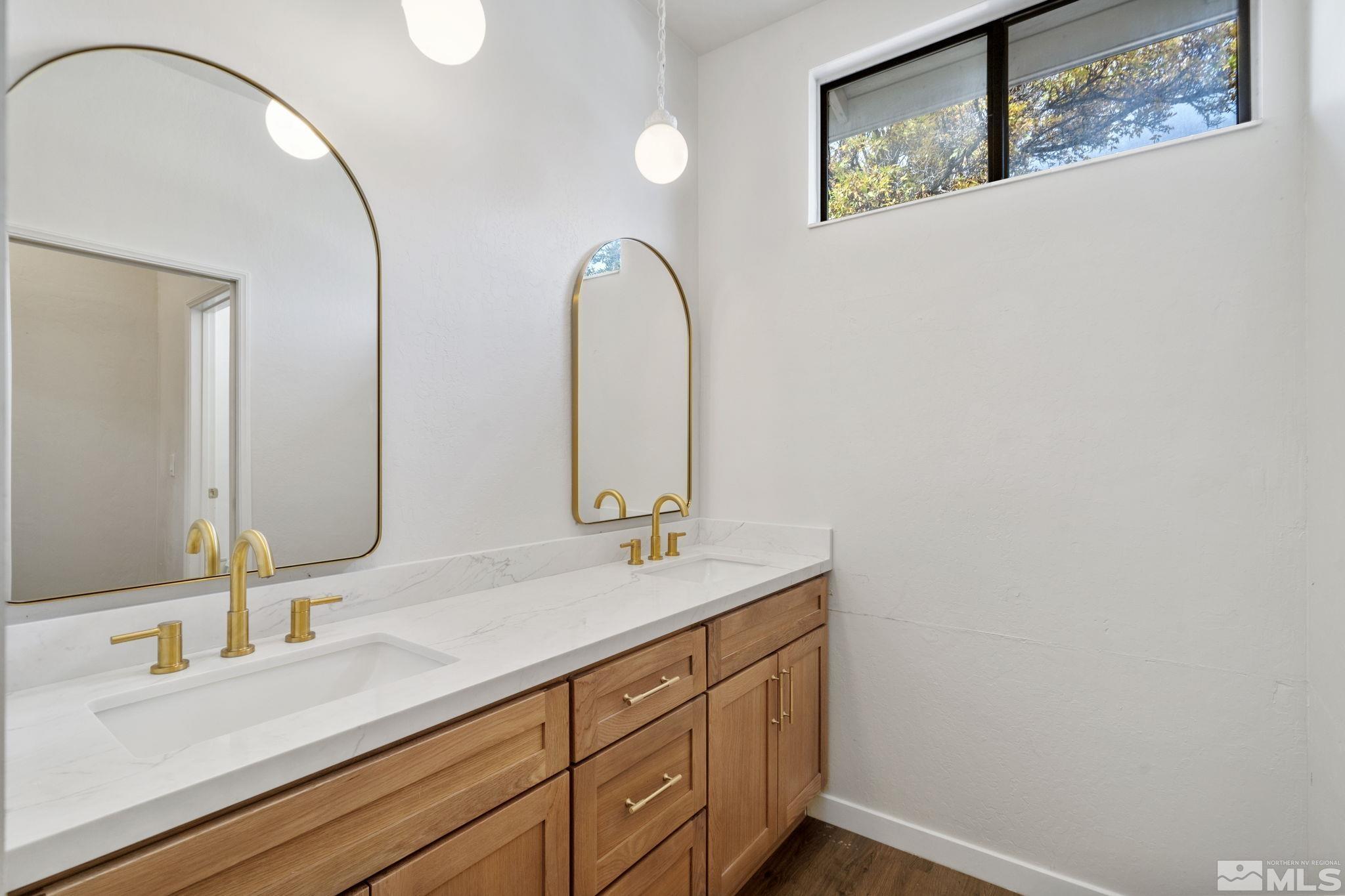 328 Lorraine Court Reno, NV 89509 - Photo 28 of 38 a bathroom with a double vanity sink and a mirror