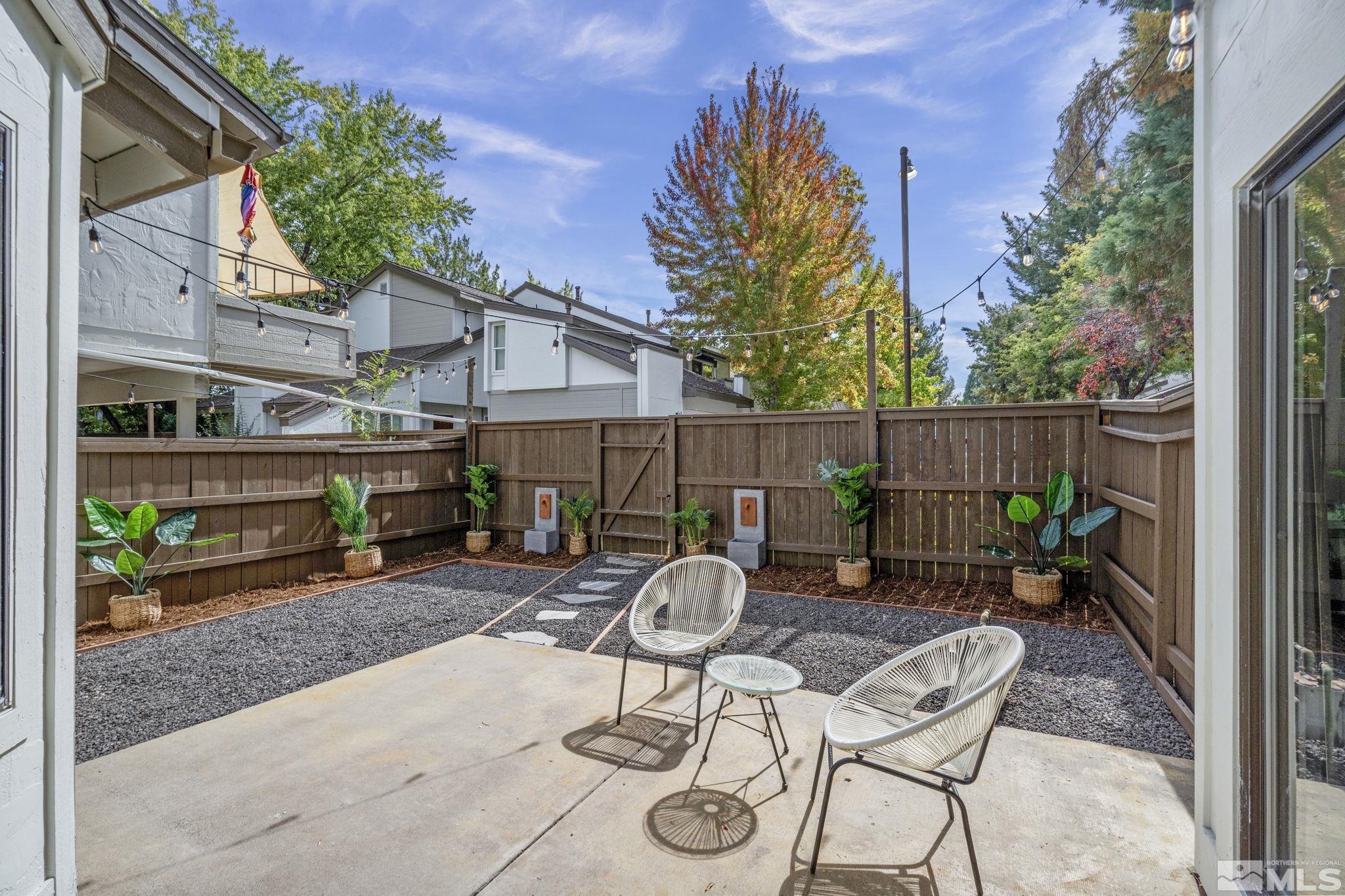 328 Lorraine Court Reno, NV 89509 - Photo 33 of 38 a view of a patio with table and chairs and potted plants