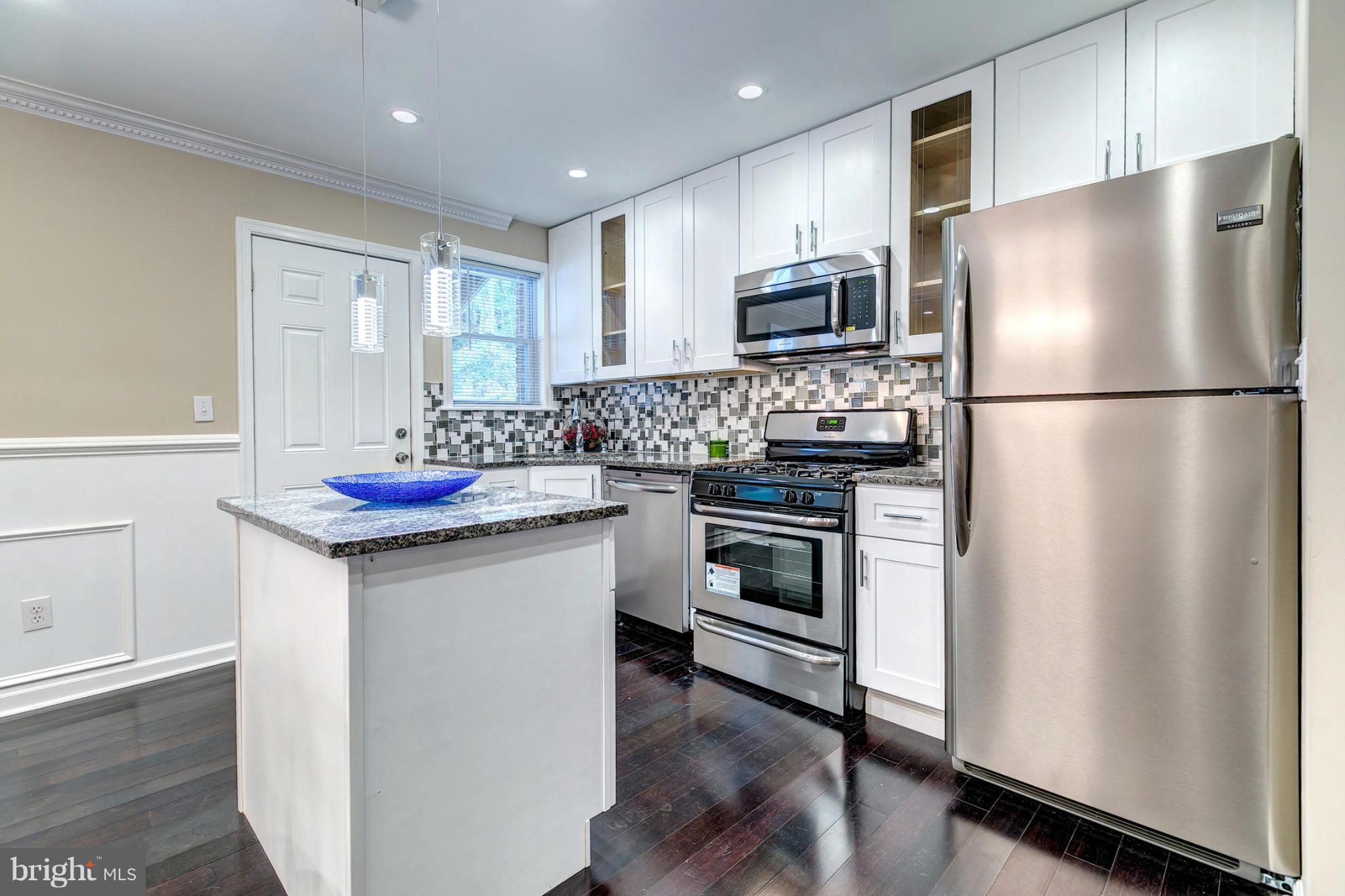 5446 Frederick Avenue Baltimore, MD 21229 - Photo 13 of 30 Granite Kitchen With Stainless Steel Appliances