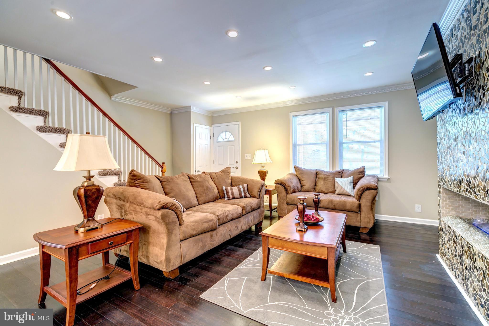 5446 Frederick Avenue Baltimore, MD 21229 - Photo 6 of 30 Spacious Living Room With Crown Moldings