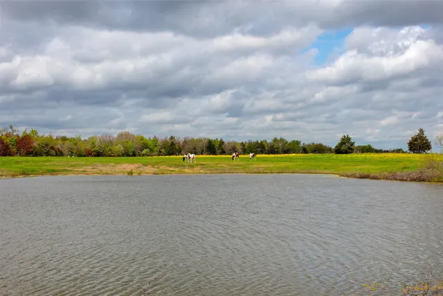 a view of a swimming pool and an outdoor seating