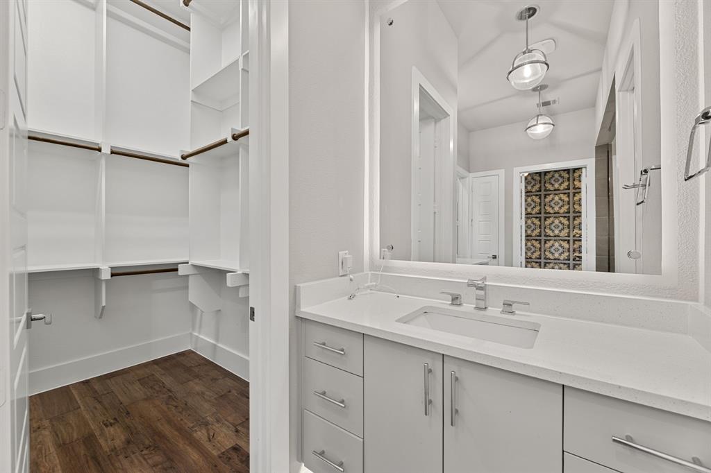 7854 Element Avenue Plano, TX 75024 - Photo 30 of 38 Full bath with a walk in closet, vanity, and dark wood-type flooring