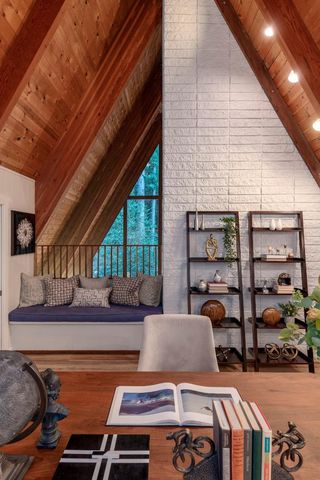 a bedroom with a bed and window with lamp