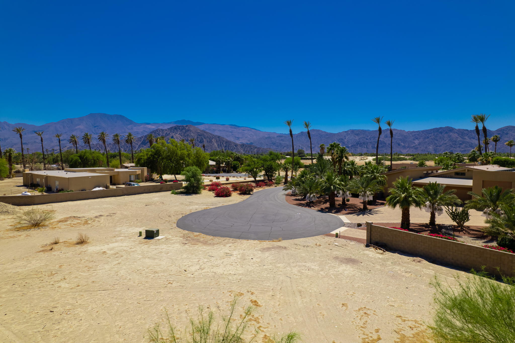 Lot 2 Mallet Court Indio, CA 92201 - Photo 2 of 18 a view of a swimming pool with a lounge chairs
