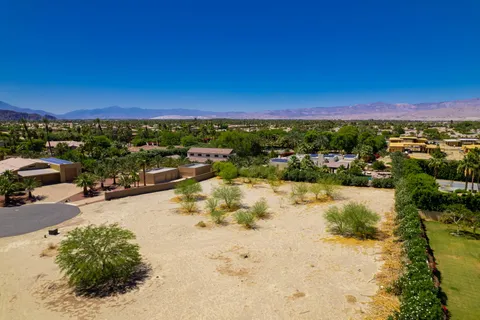 a view of a lake with a car park in front of it