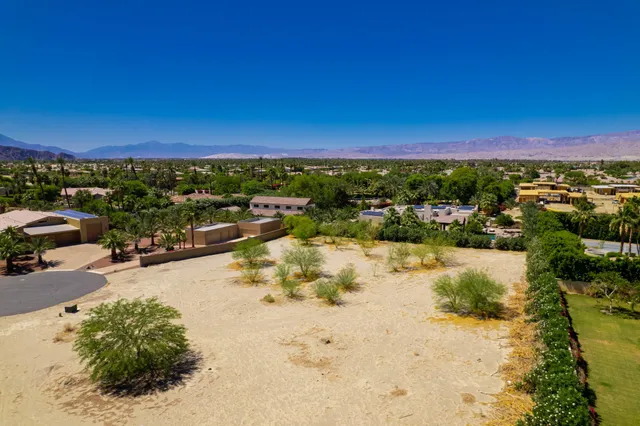 a view of a lake with a car park in front of it