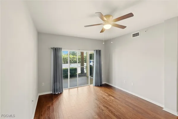 a view of cabinets and wooden floor