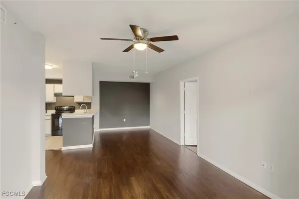 a kitchen with a refrigerator and a sink