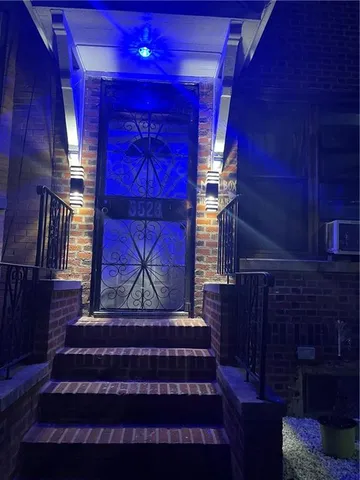 a view of a brick building with a yard