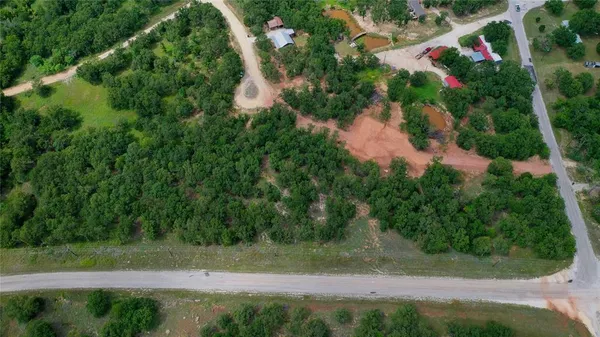 a big yard with lots of green space and deers